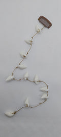 Bijou de cheveux orné de coquillage