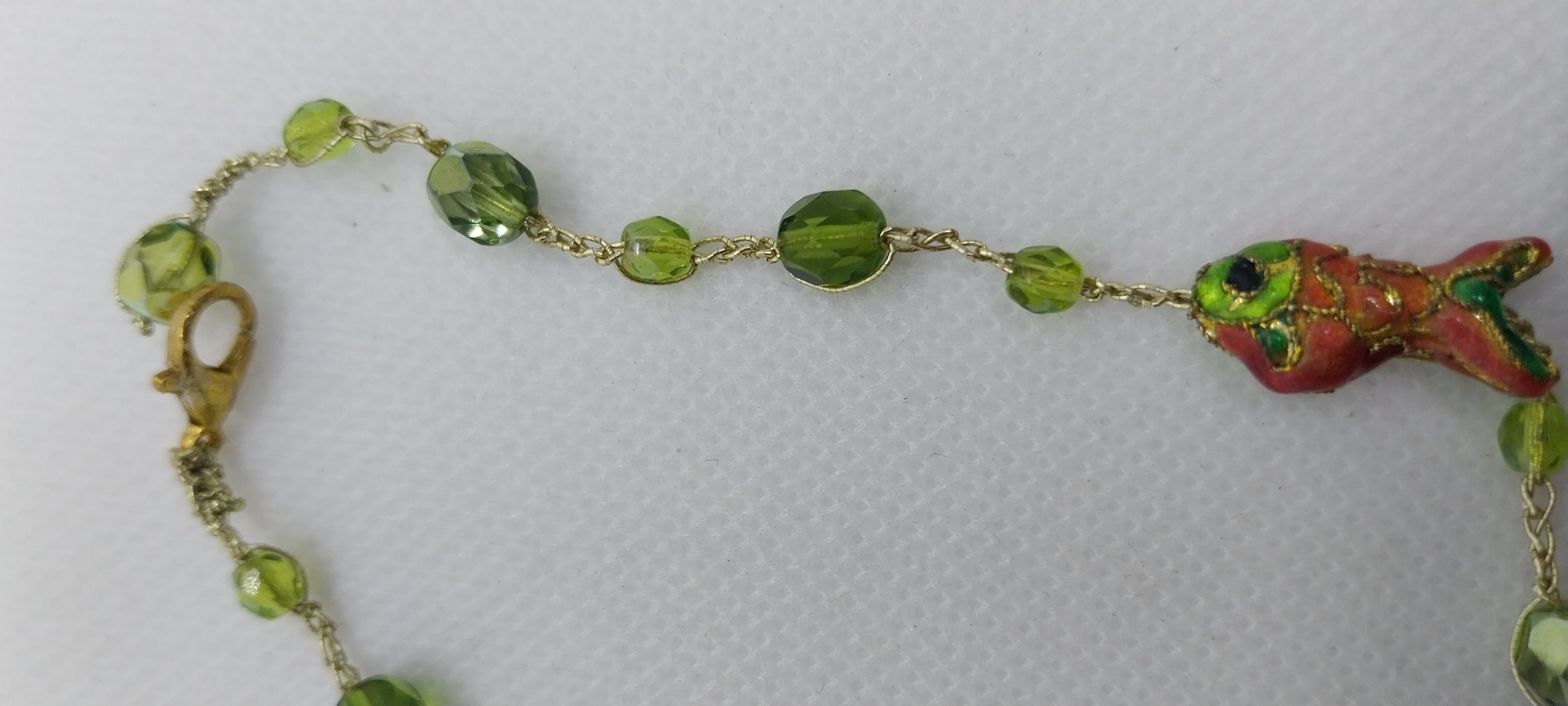 Green crystal bead anklet & orange and green fish bead